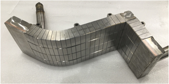 One outer-divertor module mock-up of the new lower divertor on EAST with ITER-like monoblock PFUs. The horizontal and vertical target plates are connected with a square end box. Water flows into the divertor module through an end box at the end of the baffle and flows out through another end box at the end of the horizontal target plate.